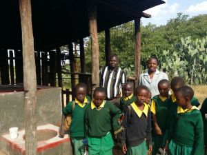 Teachers and Students of Sura Adoru Primary School outside their  Kitchen where we constructed an energy saving jiko of 250 litres and an additional domestic stove. 